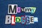 MOMMY BLOGGER text word collage colorful fabric on blue denim, parenting blogs and blogging