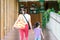 Mommy and daugther child while walking in a park