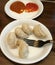 Momo is a type of South Asian steamed filled dumpling, popular across the Indian subcontinent and the Himalayan regions .