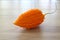 Momordica charantia isolated on a wooden background. Ripe whole fruits of Momordica charantia, also known as bitter melon or bitte