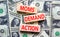 Moms demand action symbol. Concept words Moms demand action on wooden blocks on a beautiful background from dollar bills. Business
