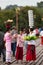 Mon people and tourists sightseeing at Uttama Nusorn Wooden Bridge