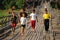 Mon refugee kids cross saphan mon wooden bridge