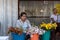 Mon woman sale flower at Wat Sao Roi Ton Temple