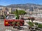Monaco, France â€“ July 24, 2017: Red double-decker bus tour driving on city streets of luxury Monaco (Monte Carlo).