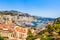 Monaco skyline view of the Hercules port with buildings roof tops and multiple yachts on the Cote d`Azur French riviera