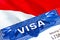 Monaco Visa in passport. USA immigration Visa for Monaco citizens focusing on word VISA. Travel Monaco visa in national