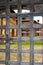 Monastery buildings through wooden latticed gates