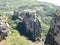 Monastery perched high up on the rocks in Meteora, Greece seen from above