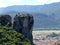 Monastery perched high up on the rocks in Meteora, Greece seen from the side