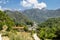 Monastery on the river Moraca amid mountains in the background.