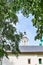 Monastery wall and bell tower framed by greenery in Yaroslavl, Russia.