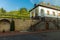 Monastery yard medieval architecture outside space Gothic style clear summer weather day time and bright colors of green grass