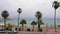 Monastir, Tunisia - 07 June 2018: People walking on city embankment with beautiful view on sea landscape. Palm trees on