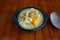 Mondongo soup in the typical kitchen environment with a spoon around it, preparation of Colombian food