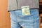 Money in back pocket jeans. Concept. Savings, spending , euros or bribe