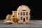 Money background, coins and house model on wooden background, bank loan concept, real estate agent, home insurance