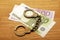 Money banknote handcuffs wooden desk background