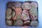 Money box full of silver, copper and golden coins (Czech Crowns, CZK)