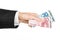 Money and business topic: hand in a black suit holding banknotes 10 and 20 euro on white isolated background in studio