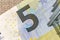 Money, busyness and finances concept. Detail part of banknote euro national currency bill. Symbol of wealth and prosperity