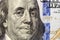 Money, busyness and finances concept. One hundred dollar bill detail with president Franklin portrait close-up. American national