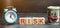 Money, clock and wooden blocks with the word Risk. The concept of financial risk. Justified risks. Investing in a business project
