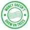 MONEY DOESN`T GROW ON TREES text on green round postal stamp sign