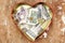 Money donation and saving in heart box