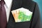 Money, Euro currency(EUR) bills, in businessman suit pocket