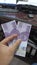 Money hand indonesian
