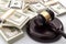 Money influence in the legal court system, corruption, auction bidding and bankruptcy conceptual idea with wood judge gavel and