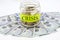 Money and a jar with the words `crisis`. Financial concept.