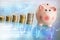 Money ladder and piggy bank o financial abstract background with graphs and charts