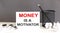 Money is a motivator text and office supplies, business concept