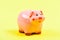 Money is a power. financial problem. money saving. piggy bank on yellow background. income management. planning budget