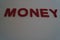 Money text in red on a plain white background