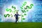 The money tree concept with businessman in growing profits