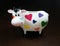 Moneybox as a cow with painted hearts