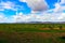 Mongolia steppe landscape of infinite grasslands under beautiful cloud in blue sly