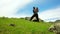 Mongolian Father lifting his daughter at grassland