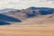 The mongolian kazakhs of western mongolia migrate each year with their herd of camels. horses, sheep, cows and goats in the snowy