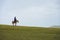 Mongolian Man Riding Ridge Hill Steppe Mongolia