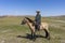 Mongolian Shepherd on Horseback