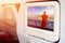 Monitor in front of passenger seat showing Unidentified buddhist monks in City view point at Golden moutain Temple,