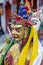 Monk with colored clothes and mask performs Cham dances, ritual dancing at Takthok festival, Ladakh, Lamayuru Gompa, India