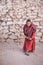 Monk with cricket bat in Ladakh