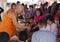 Monk dispenses strings at Thai temple