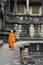 Monk enters an ancient temple at Angkor Wat