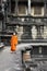 Monk enters an ancient temple at Angkor Wat